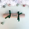 DIY Personalised Christmas Cracker in green with cursive font Sample of DIY Personalised Christmas Cracker in green with name in cursive font