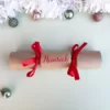 cursiveRedCracker Sample of DIY Personalised Christmas Cracker in red with name in cursive font