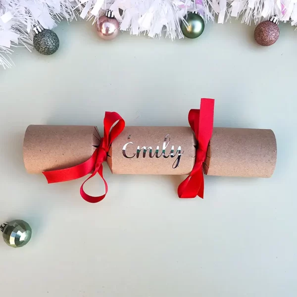 Sample of DIY Personalised Christmas Cracker in red with name in silver cursive font
